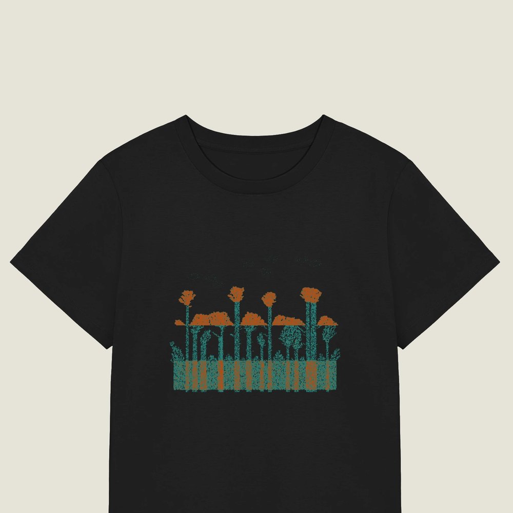 Planar Cut Through Deposition on a black Women's organic tee